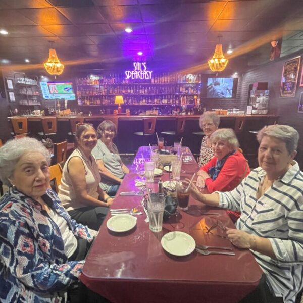 Seniors eating dinner together