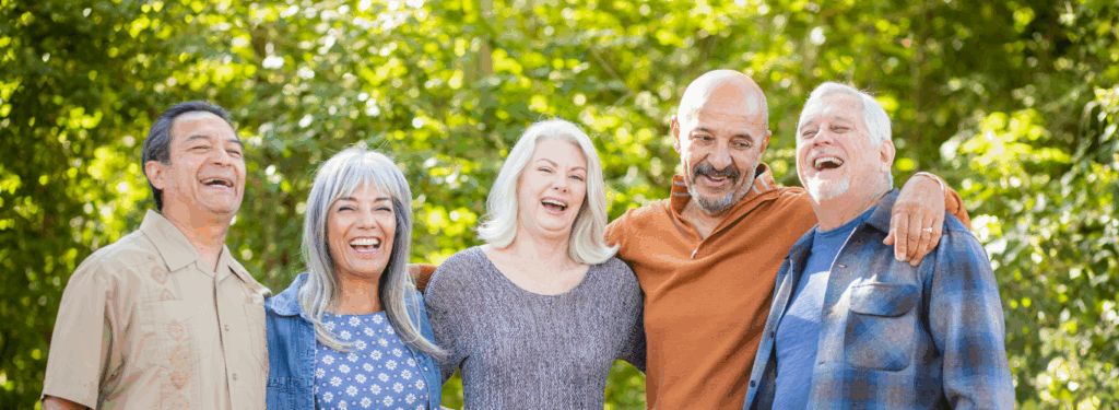 A group of seniors pose for a photo outside